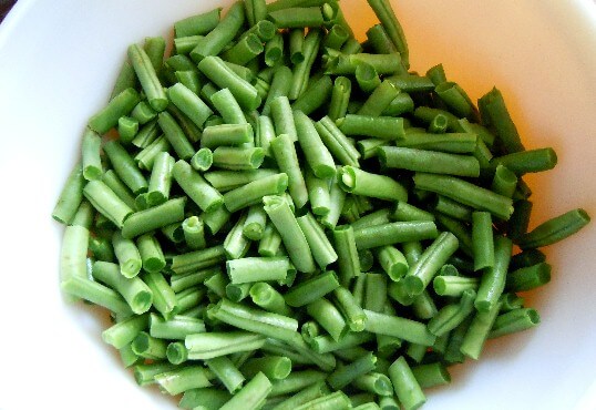 Fresh green beans cleaned and snapped for freezing in the article Blanching Vegetables.