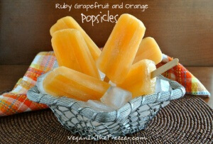 Ruby Grapefruit and Orange Popsicles Front stuck in ice every which way.