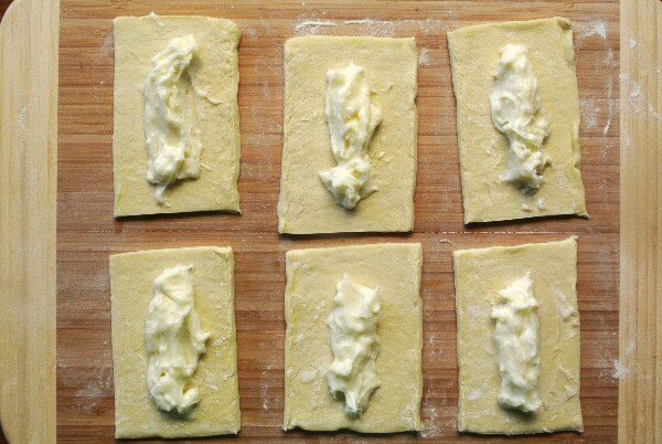 Sic puff pastry rectangles with filling down the middle.