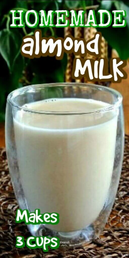 Close up view of a full glass of homemade almond milk on a chocolate colored plant with green behind. Text above for pinning.