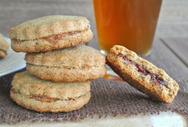 Raisin Filled treats are stacked off balance with a bite out of one.