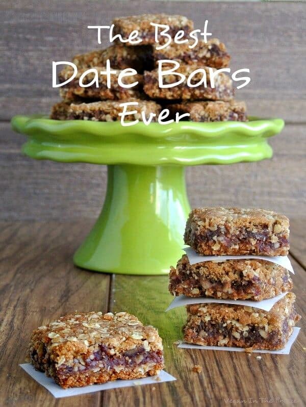 Stacks of date bars in front of a green compote with more on the plate.