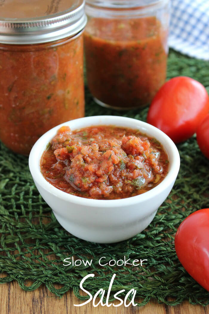 Slow Cooker Salsa is so delicious and it adds a depth of flavor to your chips, tacos, sandwiches, soups and much more. #Crockpot cooking indoors or out!