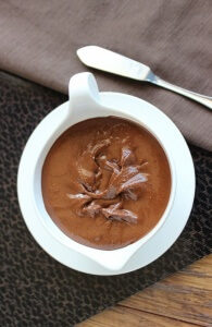 Overhead view of chocolate spread in a white serving bowl.