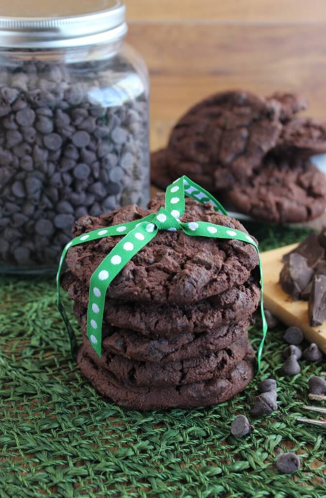 Deep rich chocolate treats from a vegan cookie recipe are baked and stacked high.