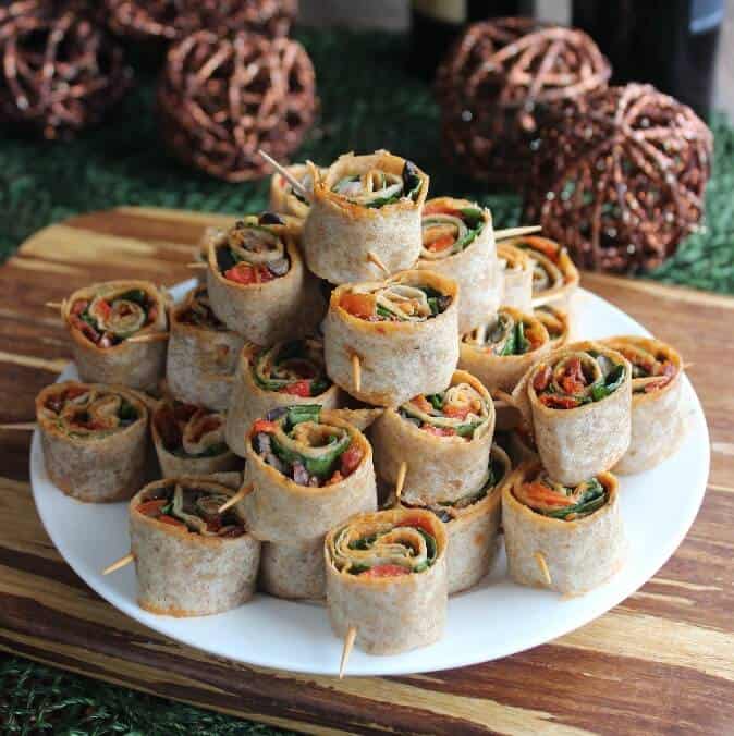 Spicy Tortilla Rollups with a close-up of the rolls with veggie layers showing at the downward angle. 