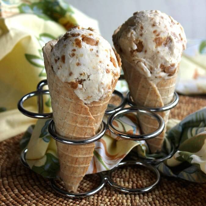 Chia Waffle Cones are stacked in a stainless holder and are filled with ice cream.