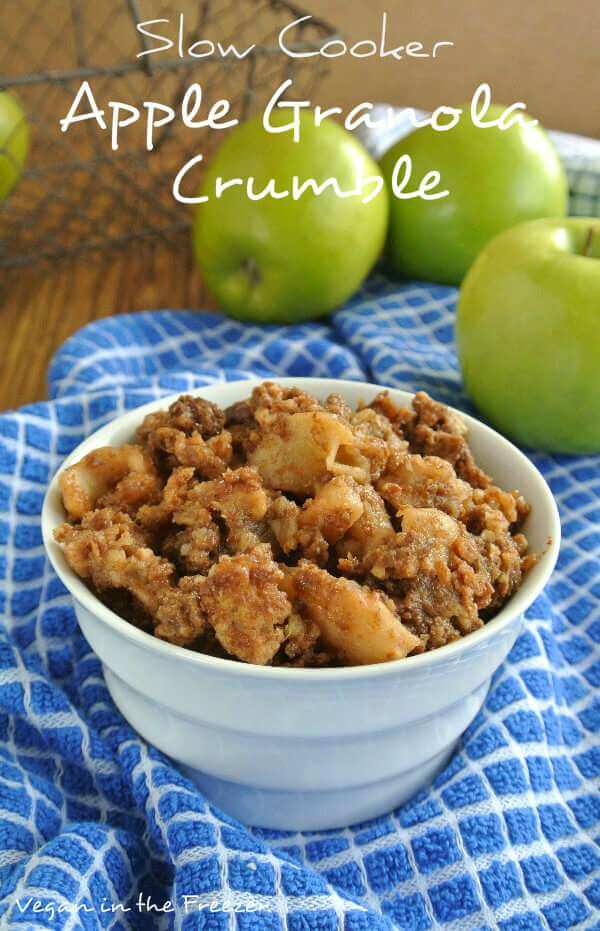 Slow Cooker Apple Granola Crumble is in a white bowl and on a blue and white checked cloth.