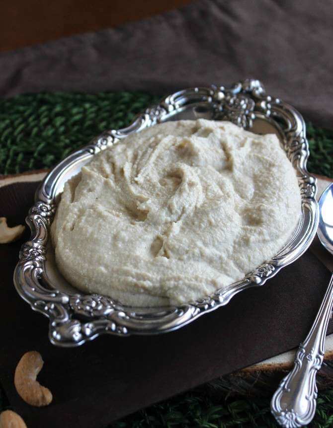 Vegan Mozzarella Cheese Spread in a small silver plate bowl.