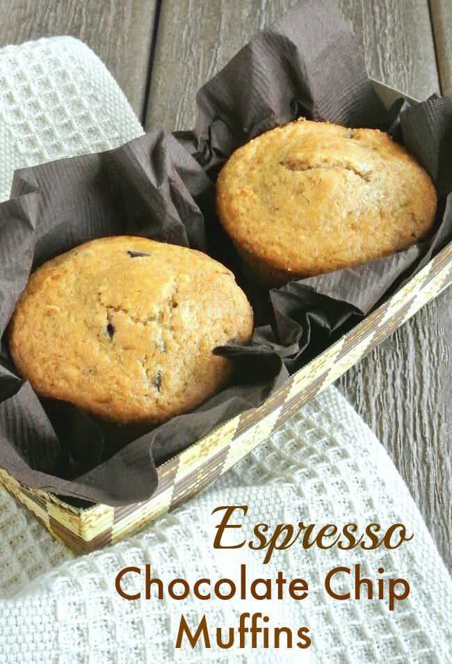 Espresso Chocolate Chip Muffins sitting in a rectangle designed holder and are also nestled in a brown napkin.