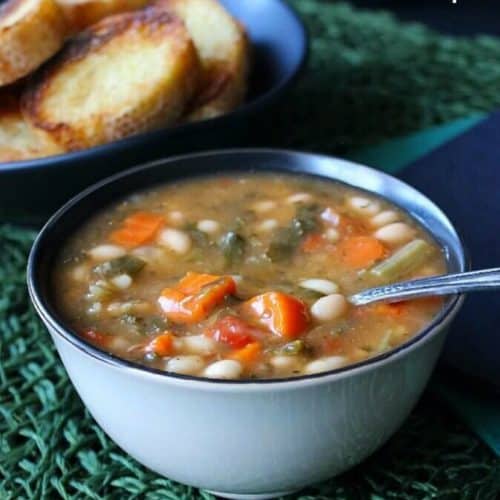 Kale White Bean Soup serves up a complete meal with this one recipe. An easy and delicious recipe that you need to make asap. Great on any night of the week.