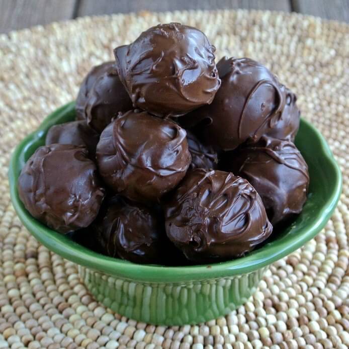 Two photos of peanut butter balls with words in the center for pinning.
