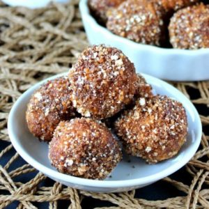 Cashew Sugared Donut Holes is an original. Little round deep fried donuts are rolled in a coconut maple flavor mixture.