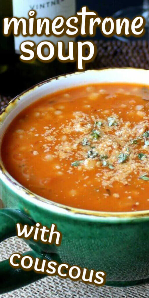 Close up views of rich minestrone soup in a giant green cup with vegan parmesdan and herbs sprinkled on top.
