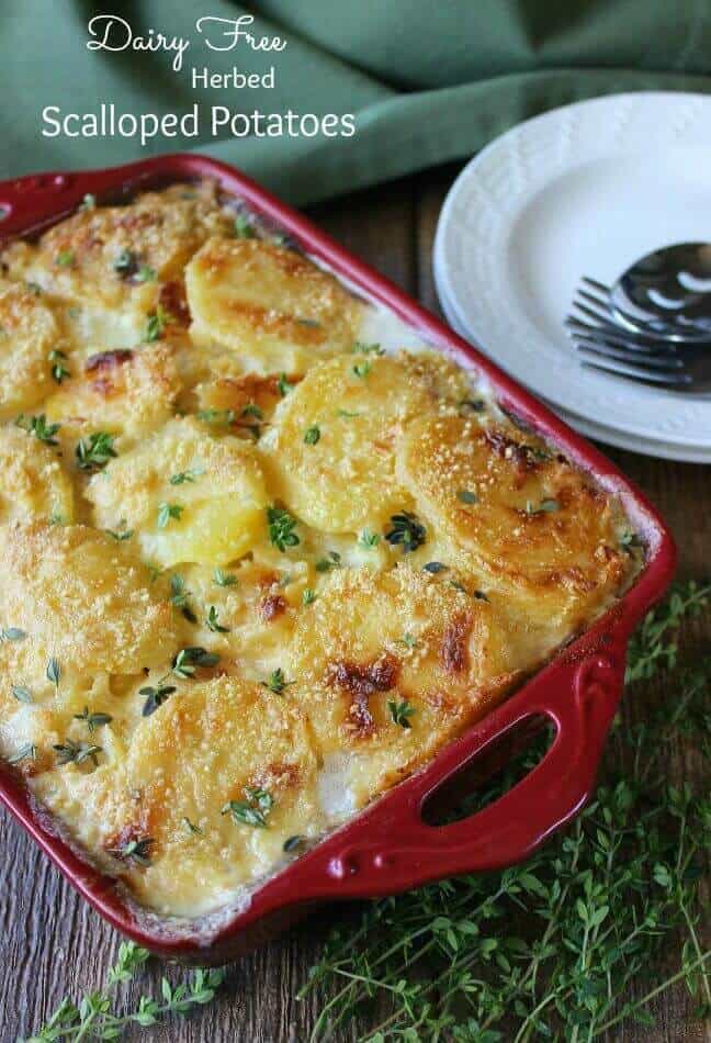 Scalloped Potatoes is baked golden brown and in a red casserole.