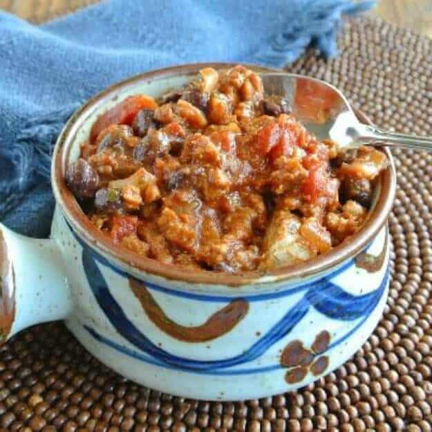 Vegan Combo Beef Sausage Chili with blue and brown background and optimized for social media shares.