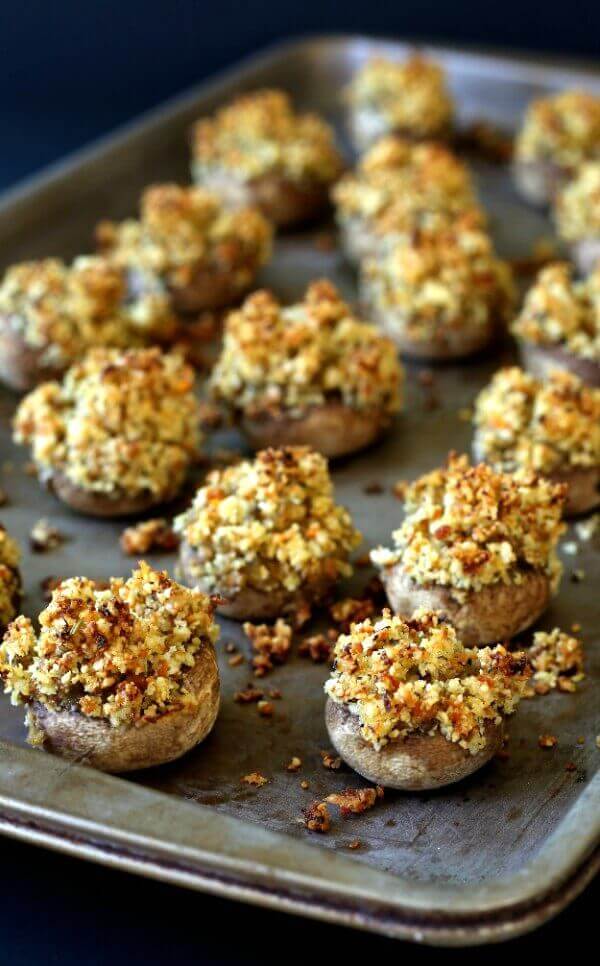 Holiday Stuffed Mushrooms are classically filled with a bit of grated carrot for a pretty and tasty recipe.