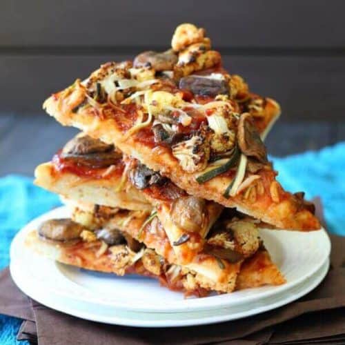 Vegan BBQ Veggie Pizza is 5 slices stacked high at all angles with the toppings tempting everyone.