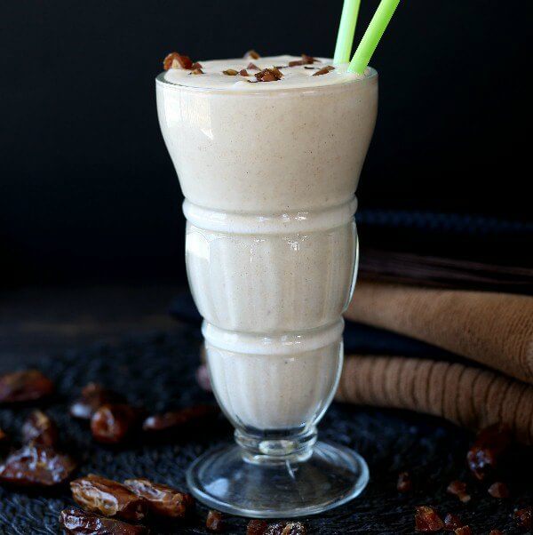 Vegan Date Shake is front and center with dates and napkins all in shades of black and brown.