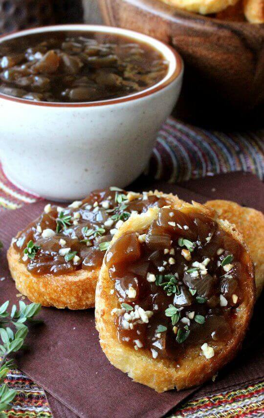 Balsamic Caramelized Onion Crostini is a slightly spicy and highly flavorful finger food or appetizer.  The topping is deep and rich in color and is also great on bean burgers!