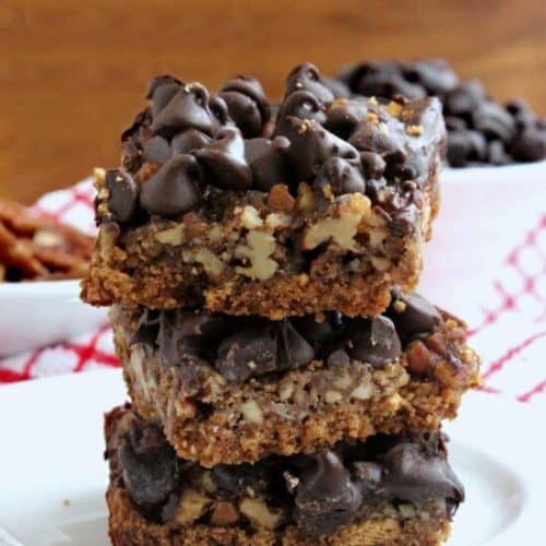 Healthier English Toffee Bars have all the flavors and layers of the original but also has a thick base of sweet oats & graham crackers then all is topped with chocolate and nuts.
