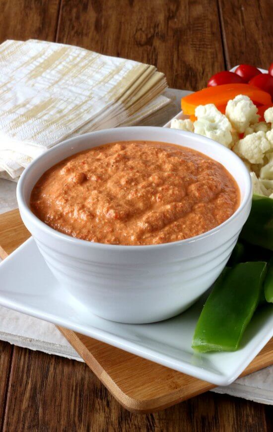 Roasted Red Pepper Sauce Dip is thick and creamy and just right for dipping in your favorite veggies.  Roasted red bell pepper classic turned into an appetizer dip!