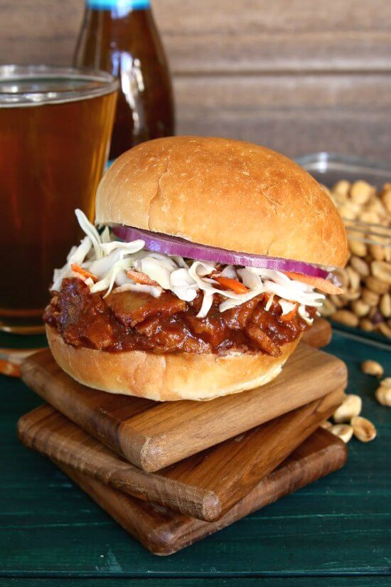 Texas BBQ Sausage Seitan Sandwich is spicy delicious! Besides vegetables there are six herbs and spices added to the mix . Serve on a big bun and then take a big bite.