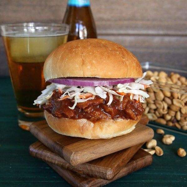 Texas BBQ Sausage Seitan Sandwich is spicy delicious! Besides vegetables there are six herbs and spices added to the mix . Serve on a big bun and then take a big bite.