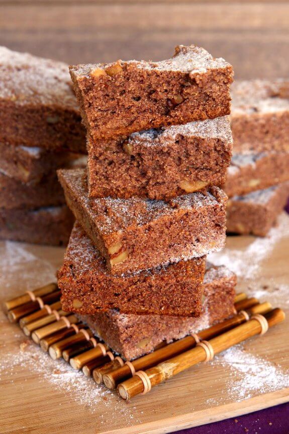 Irish Blackberry Cakes are square cakes and are stacked high with the top two being broken in half for a look inside.