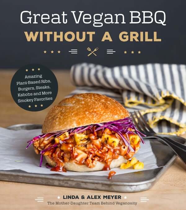 Boneless BBQ Buffalo Wings are inside the cookbook titles. Great Vegan BBQ Without a Grill. On the cover is an oozing plant based burger of saucy veggies and purple cabbage.