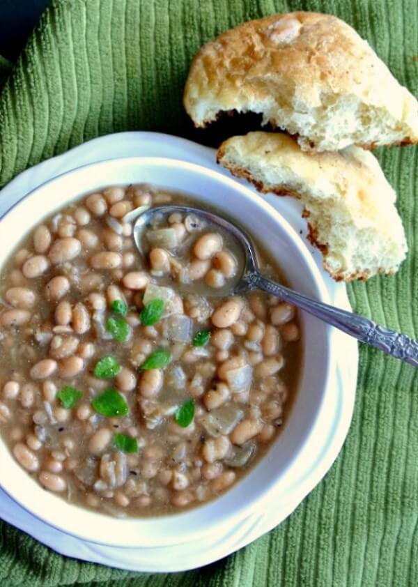 White Bean Chili with an overhead photo to show all the veggies and spices swirling in the broth.