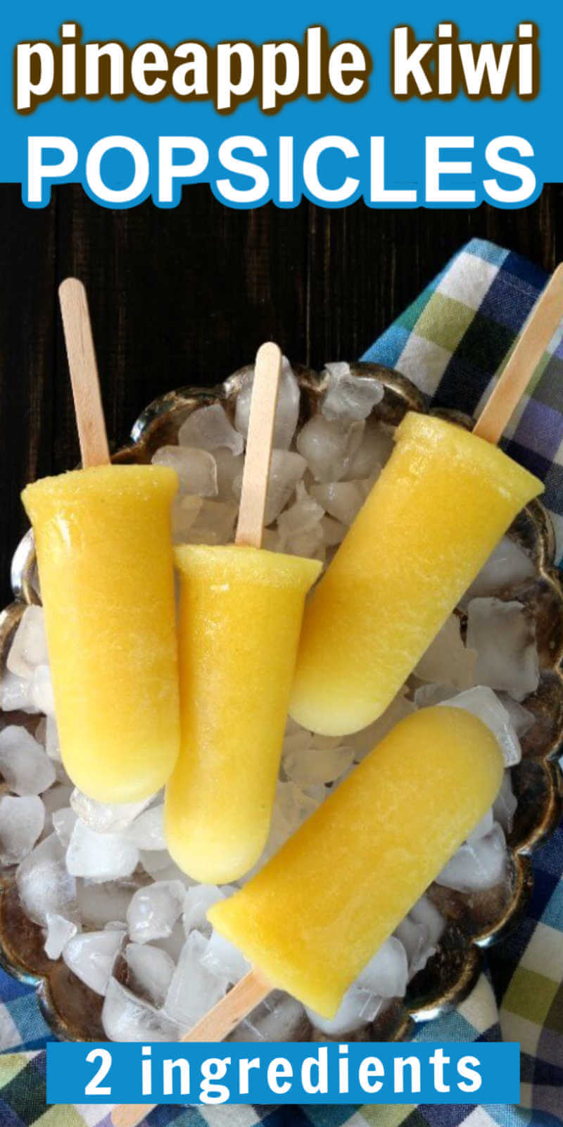 Overhead yellow popsicles on a silver platter full of ice.