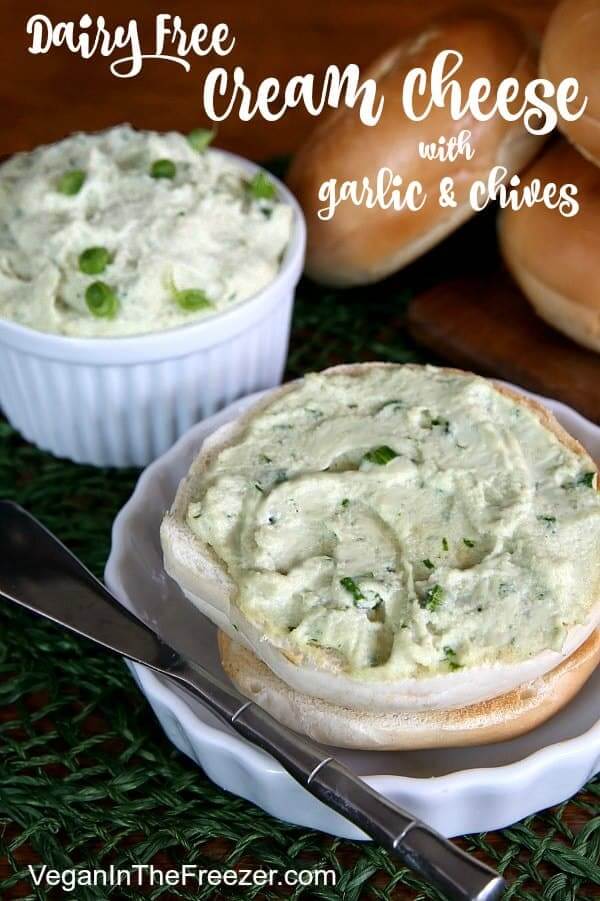 Dairy Free Cream Cheese is spread on a toasted bagel half with chives peeking through. Title script across the top.