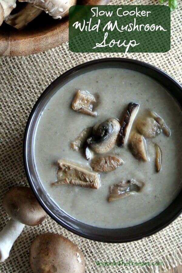 Overhead view of creamy mushroom soup with wild mushrooms peeking through the middle.