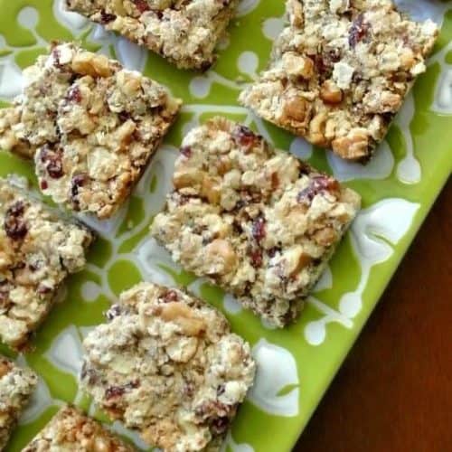 Overhead photo and close-up up healthy snack bars cut into squares and showing cranberries and dates.