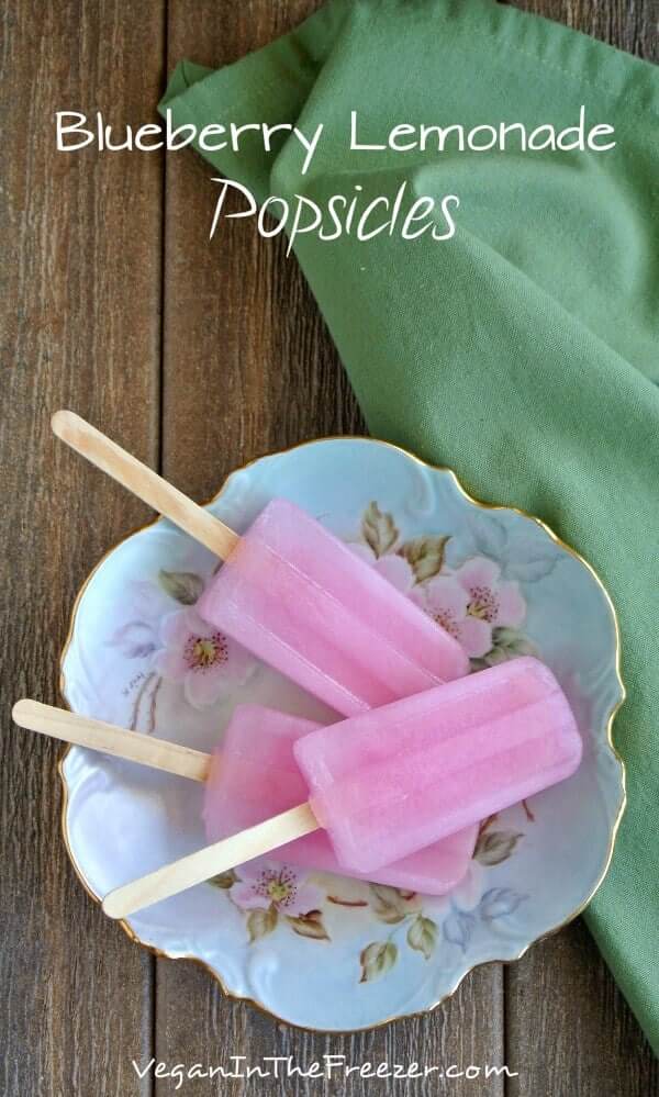 Overhead view of pink pops on a pink and blue flowered bowl on a picnic table with text to explain the treat.