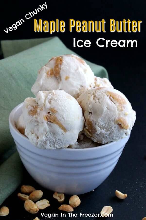 A white bowl with 5 huge scoops of ice cream with one single scoop and bowl in front with peanuts scattered around.