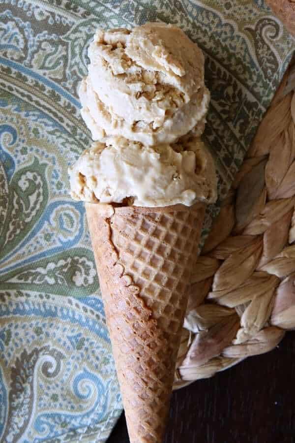 View of two scoops of vegan dessert on a sugar cone.