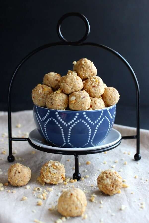 Front photo of peanut butter balls spilling over onto a beige cloth.