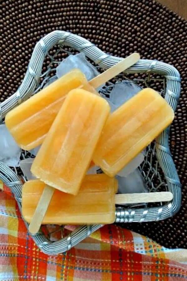 Overhead photo of a homemade popsicle recipe in a silver star shaped basket.