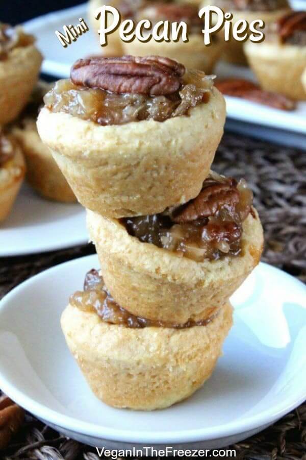 Three mini pecan pies are stacked on top of each other trying not to fall over.