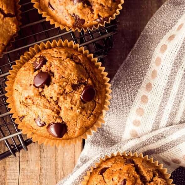 Square photo of one off center muffin with two peeking in on the sides.