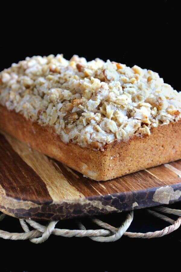 close up angle of a loaf of banana bread covered with cereal streusel.