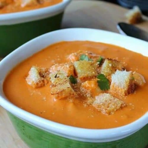 Close-up photo of creamy vegan tomato soup.