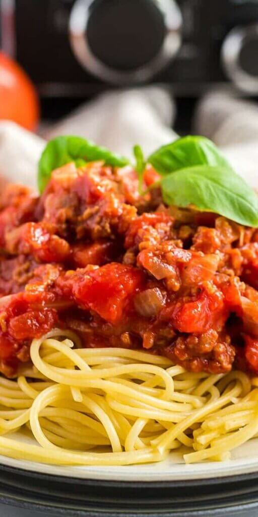 Very close up photo of spaghetti sauce.
