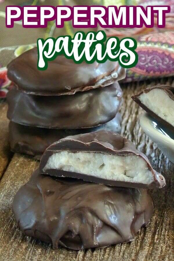 Stack of glistening chocolate peppermint patties with one broken in front.