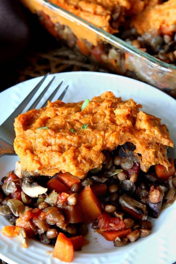 Close up View of Vegan Spepherd's Pie with lentils and more veggies baked with mashed sweet potatoes on top.