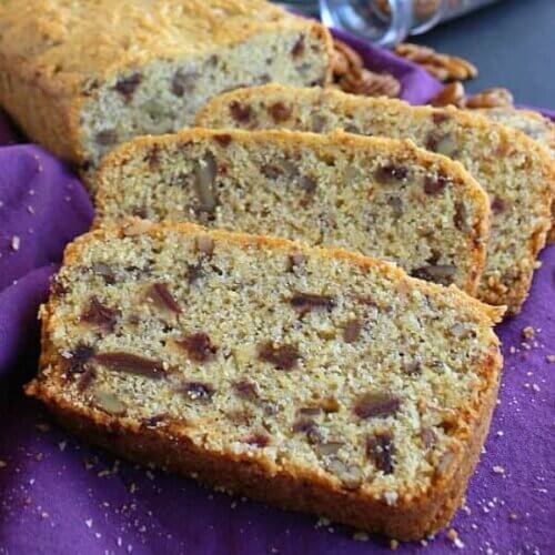 Overlapping slices of cornbread filled with dates and pecans.