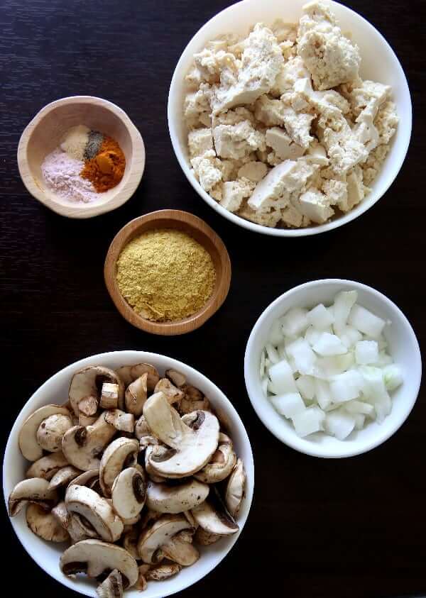 Ingredients separated into individual bowls of different shapes and sizes.