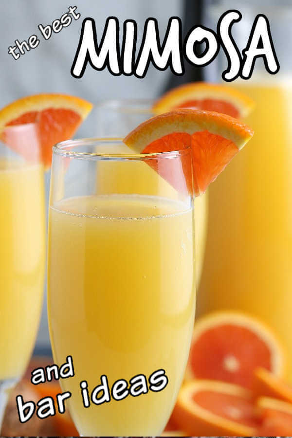 Close-up of mimosas with orange slices as garnish and text for pinning.